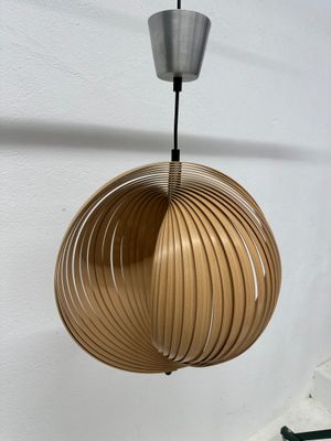 the light fixture is hanging from the ceiling in the room
