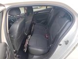 the back seats of a car with a seat belt in the passenger seat