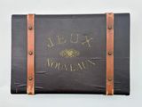 a suitcase with writing on it sitting on a white surface