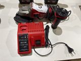 a picture of a corded drill and other tools on a table