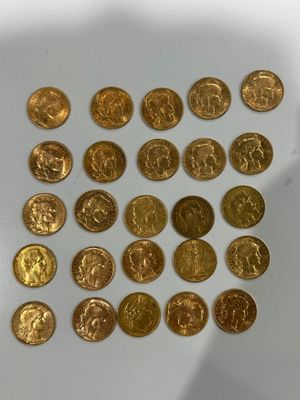 a lot of gold coins that are on the table