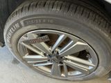 a close up of a car tire with a sticker on it