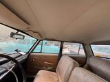 a view of the inside of a car from the driver ' s seat