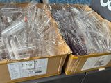 two boxes full of electronic devices on the shelf