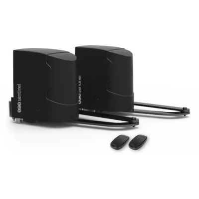 a couple of black speakers sitting next to each other on a white surface