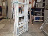 a ladder that is leaning against a wall in a room