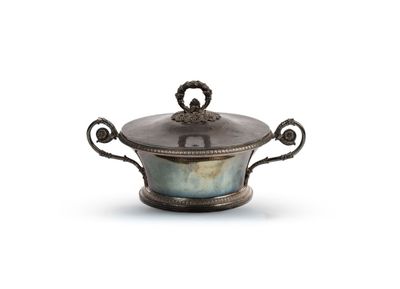 an antique silver plated bowl with handles and a lid