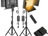 two light stands and a remote control are shown in this image