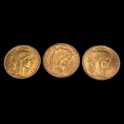 three gold sovereigns, one of which is a sovereign and one of which is a sovereign