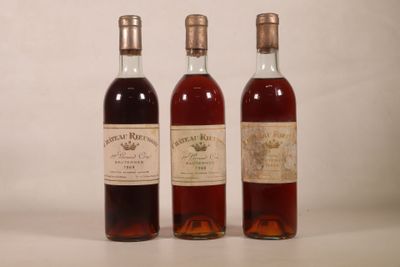 three bottles of wine sitting next to each other on a table