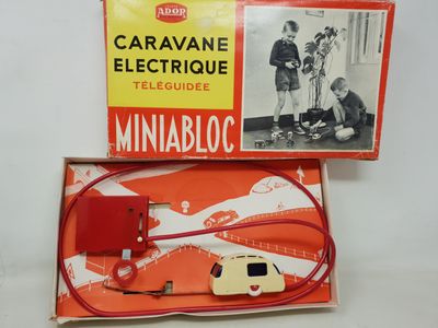 a box with an electric cable and a car in it
