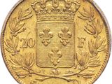 a close up of a gold coin with a crown on it