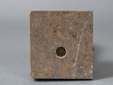 a marble block with a hole in the middle of it