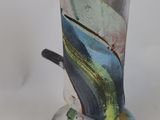 a vase that has a design on it on a white surface