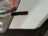a close up of a car ' s headlight with a sticker on it