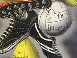 a poster of a pair of tennis shoes and a soccer ball
