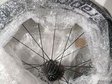 a close up of a bicycle tire covered in snow