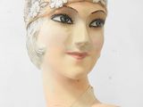 an image of a mannequin head with a head piece on it