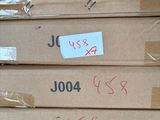several boxes are stacked on top of each other in a warehouse