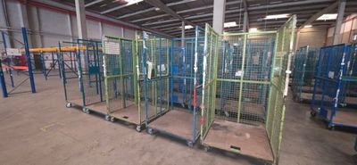 a large room with a lot of cages on the floor