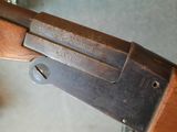 a close up of a rifle that is on a table
