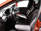 the interior of a small car with a steering wheel and dashboard