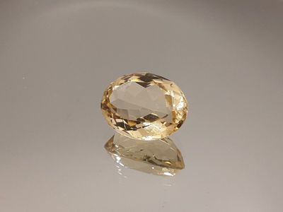 an image of a yellow diamond sitting on top of a white surface