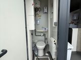 a small bathroom with a toilet and a shower