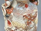 a large vase with many designs on it on a table