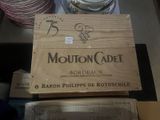 boxes of wine are stacked on top of each other on a table