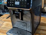 an espresso machine sitting on top of a wooden table