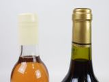 two bottles of wine next to each other on a table
