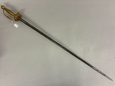 an old sword with a wooden handle on a white surface