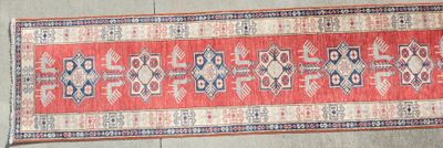 rug on the floor is red and blue with a pattern on it