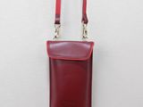 a close up of a small red purse on a mannequin mannequin mannequin mannequin mannequin mannequin mannequin mann
