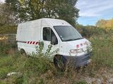 a white van that is parked in the grass