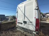 a white van that is parked on the side of the road