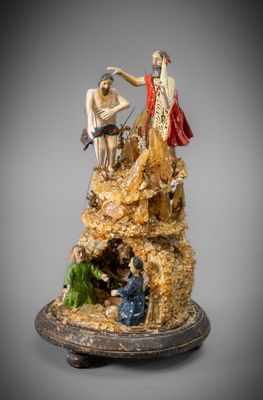 an image of a statue of a man and a woman on a rock