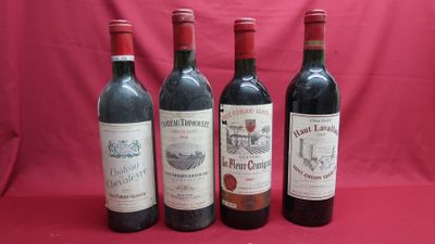 four bottles of wine are lined up on a red background