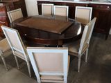 a dining room table with six chairs around it