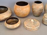 a group of vases that are sitting on a table