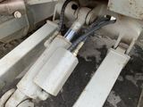 a close up of a machine with a hose attached to it