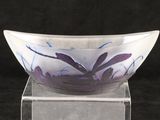 a glass bowl that is sitting on top of a stand