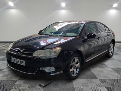 a picture of a black citrole parked in a showroom
