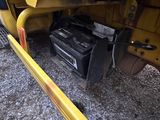 a close up of a yellow train car with a broken battery