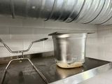 a pot that is sitting on the stove in the kitchen