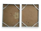pair of two framed pictures of a couple of letters on a white background