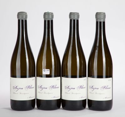 three bottles of wine sitting next to each other on a white surface