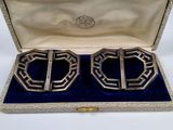 pair of silver plated cufflinks in a box with velvet lining