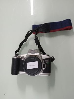 a small camera attached to a lanyard on the wall